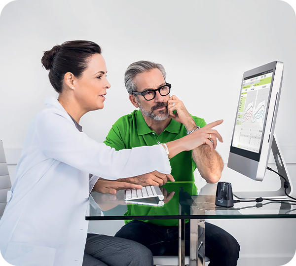 How Much Do Hearing Aids Cost in Australia? A Straight-Talking 2026 Guide Audiologist discussing hearing-aid funding options with a patient
