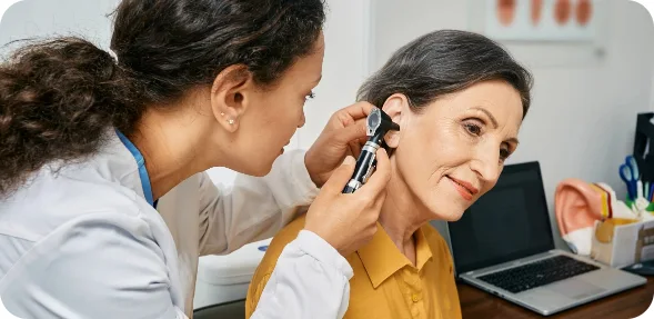 HSP Changes in 2027: 5 Steps Perth Pensioners Should Take Now to Protect Their Hearing Aid Funding Audiologist examining a patient’s ears during an adult hearing appointment